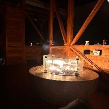 Glass-ringed fire pit in the seminar pavilion